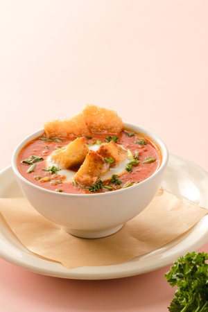 Classic Tomato Soup with eggs served in a dish isolated on background side view of fastfoodの写真素材