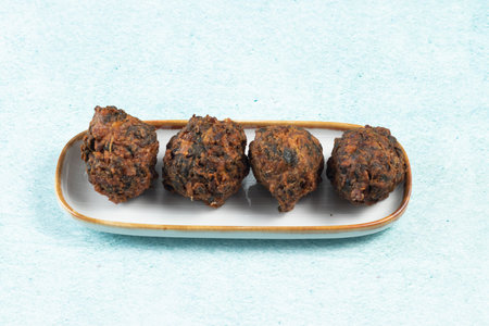 Indian spicy vegetable pakora or pakoda served in dish isolated on table top view
