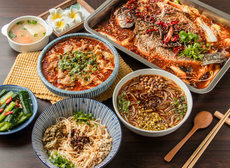 Assorted Spicy Grilled Fish, Pork Maocai, Hot and Sour Rice Noodles, Chongqing Small Noodles served in dish isolated on table top view of taiwan foodの写真素材