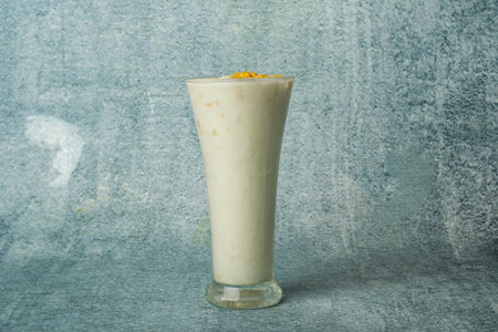 Fresh Malai Lassi served in a glass isolated on grey background top view of bangladesh foodの写真素材