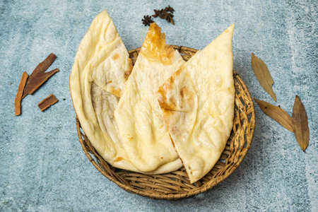 Butter Naan with chili sauce served in a basket isolated on grey background top view of bangladesh foodの写真素材