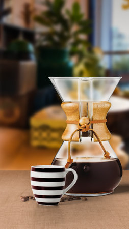 CHEMEX COFFEE maker filter with black coffee cup isolated on table side viewの写真素材