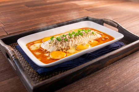 bridge tofu with egg served dish isolated on wooden table top view of Hong Kong foodの写真素材