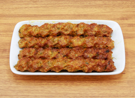 Spicy bbq beef seekh kabab served in a dish isolated on grey background side view of indian, pakistani foodの写真素材