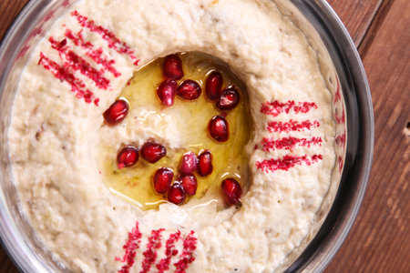 Motabal or mutabal and baba ghanoush with pomegranate seeds served in dish isolated on background top of arabic food cold mezzaの写真素材