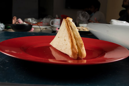 Fresh club sandwich filled with chicken and mayo dip isolated on table top view of indian food