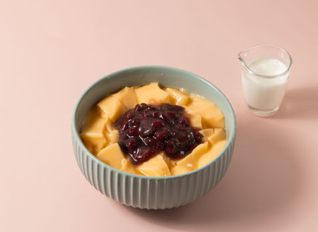 Red Bean Pudding served in bowl isolated on background top view of taiwan foodの写真素材