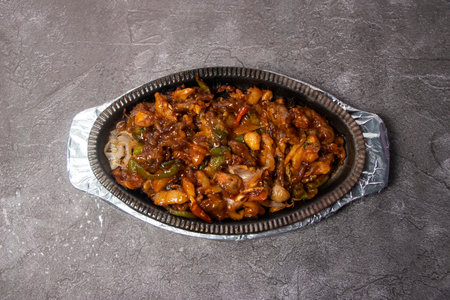 Beef Sizzling served in dish isolated on background top view of bangladesh foodの写真素材