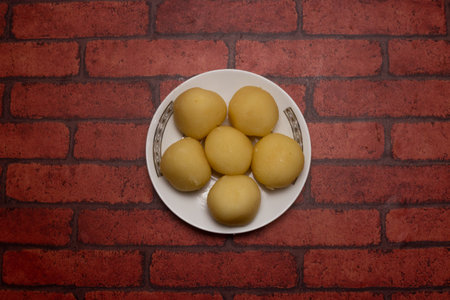 Roshogolla or Rasgulla sweet served in plate isolated on background top view of bangladeshi dessert foodの写真素材
