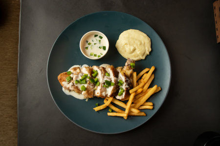 Stuffed Chicken filled with fries and mayo dip sauce served in dish isolated on background top view of bangladesh and indian foodの写真素材