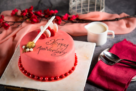 Happy anniversary Red Pearl Cake or women day and valentine celebration served on board isolated on napkin side view of cafe bake foodの写真素材