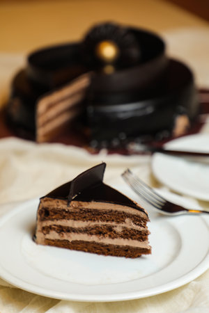 Black Forest Cake slice include chocolate chip, fork, sugar baked served in plate isolated on table side view bake cafeの写真素材
