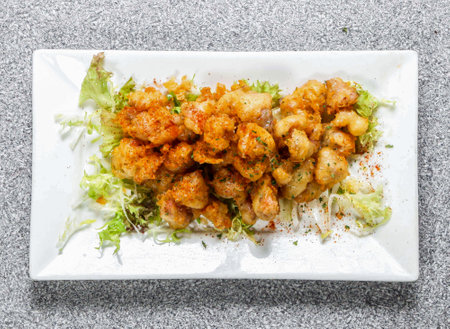 Spicy Crispy Chicken Cartilage topping with chilli powder served in dish isolated on background top view of hong kong foodの写真素材