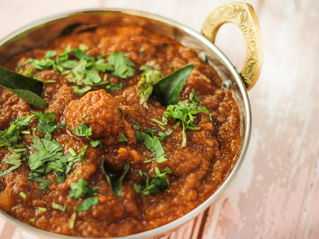PANEER BUTTER MASALA Korma served in karahi isolated on table closeup top view of indian spices foodの写真素材