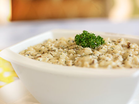 Shrimps RISOTTO topping with coriander closeup served in pot isolated on table side view of arabic foodの写真素材