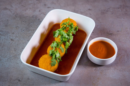 Jalapeno cheese balls with tomato sauce served in dish isolated on grey background top view of bahrain foodの写真素材