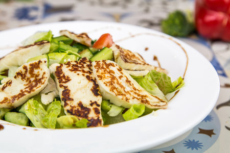Halloumi Salad with cucumber and tomato served in dish isolated on table top view of arabic foodの写真素材