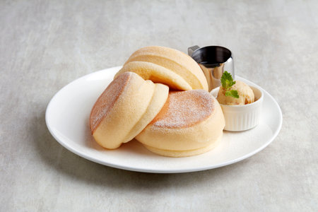 Honeycomb and Nut Butter in white plate on grey backgroundの写真素材