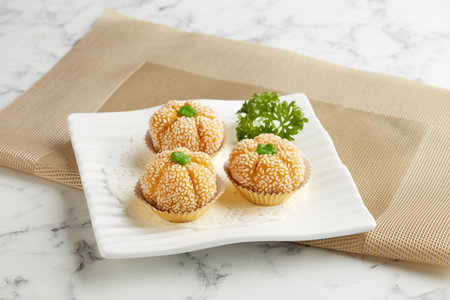 Pan-fried Pumpkin Red Bean Pastry served in a dish isolated on mat side view on grey backgroundの写真素材