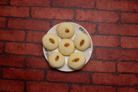 Sandesh or Shondesh sweet served in plate isolated on background top view of bangladeshi dessert foodの写真素材