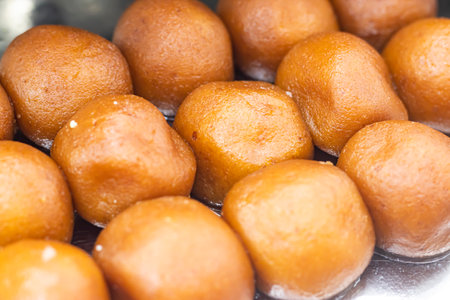 Lalmohan, Lal Mohan or Gulab Jamun texture closeup side view of Indian, pakistani and bangladeshi sweet dessert foodの写真素材