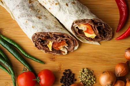 Beef Doner Wraps Shawarma isolated on wooden table closeup top view of arabic and turkish street foodの写真素材