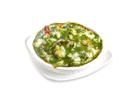 Creamy Spinach and seafood Baked Rice served in pot isolated on white background side view of italian cuisineの写真素材