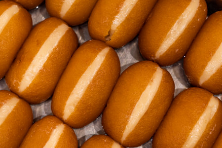 Cream Gulab Jamun closeup top view of indian, pakistani and bangladeshi sweet dessertの写真素材