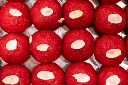 Motichoor Laddu topping with nuts texture closeup top view of indian, pakistani and bangladeshi sweets dessertの写真素材