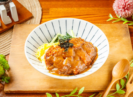 Japanese Curry Pork Chop Rice served in dish isolated on wooden table side view of taiwan foodの写真素材