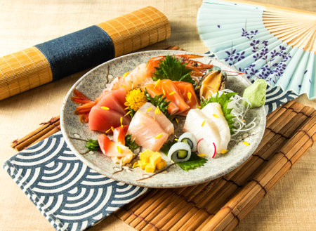 Assorted Sashimi with salmon sashimi, Tuna fish, swordfish served in plate isolated on napkin side view on wooden background of Japanese foodの写真素材