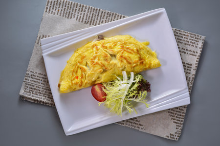 Spanish Omelette breakfast served in dish isolated on napkin top view on grey backgroundの写真素材