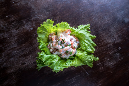 Cocktail Di Gamberi or gamberetti prawn cocktail salad with cream sauce and lettuce leaves served in bowl isolated on table side view of italian foodの写真素材