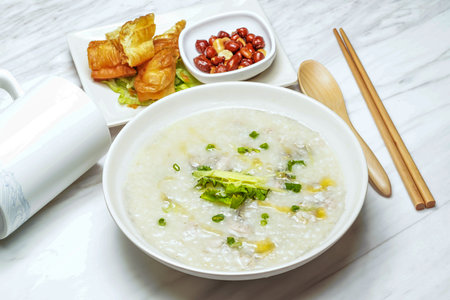 Taiwanese Oyster Porridge, Crispy Youtiao, deep fried dough pastry, red bean served in dish isolated...