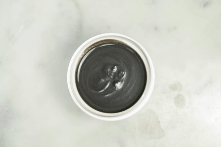 Sesame paste served in bowl isolated on grey background top view of asian food