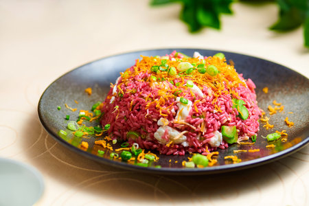 Purple Rice or Stir fried health rice with golden legs and scallops served in plate isolated on table background side viewの写真素材