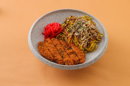 Pork Chop Cutlet with Kansai Fried Noodles served in bowl isolated on background top view of hong kong foodの写真素材