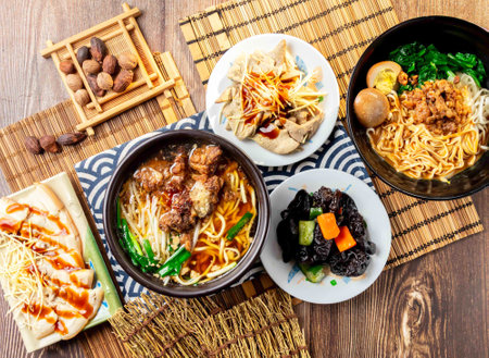 assorted taiwan side dishes Pork Ribs Crispy Noodles, sesame paste noodles, Black Fungus, Pork liver, Garlic white meat, Preserved egg, served in dish isolated on napkin top view on table taiwan foodの写真素材