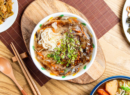 Taiwanese Braised vegetable Noodles Soup with carrot, green onion and coriander served in bowl with...