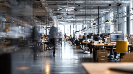 Blurred image of business people walking in a modern office building.の素材