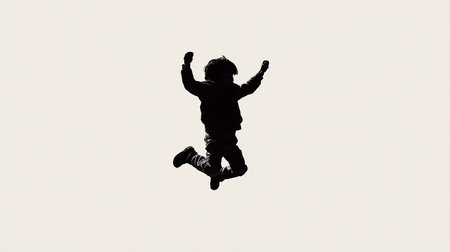 Silhouette of a little boy jumping in the air on a white backgroundの素材