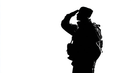 Silhouette of a soldier saluting on a white background.の素材
