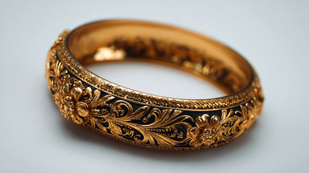Beautiful gold ring on a white background, close-up.の素材