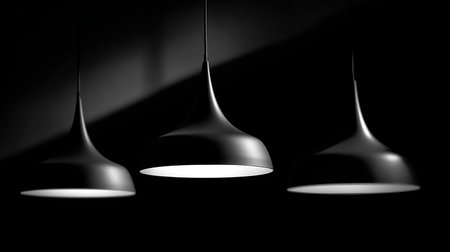 3d render of two black lamps on a black background with copy spaceの素材