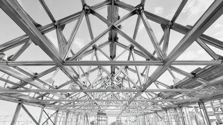 Steel structure of a building under construction. Black and white photo.の素材