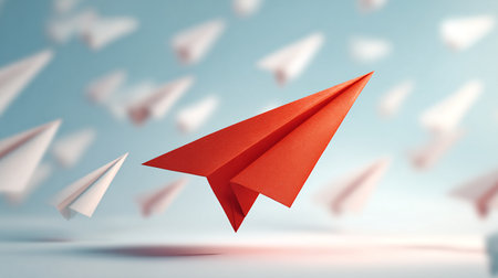 Paper plane flying among white paper planes. Concept of leadership and success. 3D renderingの素材