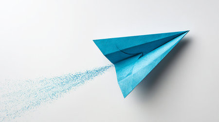 Paper plane made of blue paper. Paper plane is flying in the sky.の素材