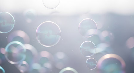 Soap bubbles with reflection on water surface. Colorful abstract background.の素材