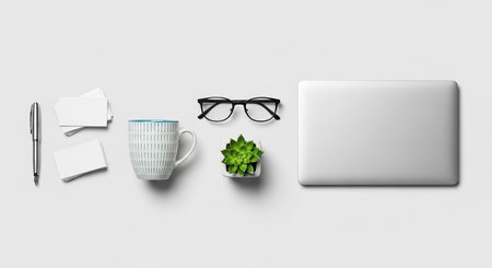Laptop, coffee cup and office supplies on white background. Flat lay, top viewの素材