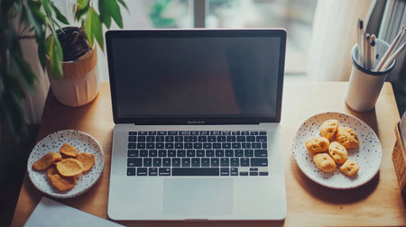 Laptop and coffee cup on wooden table in coffee shop, stock photoの素材